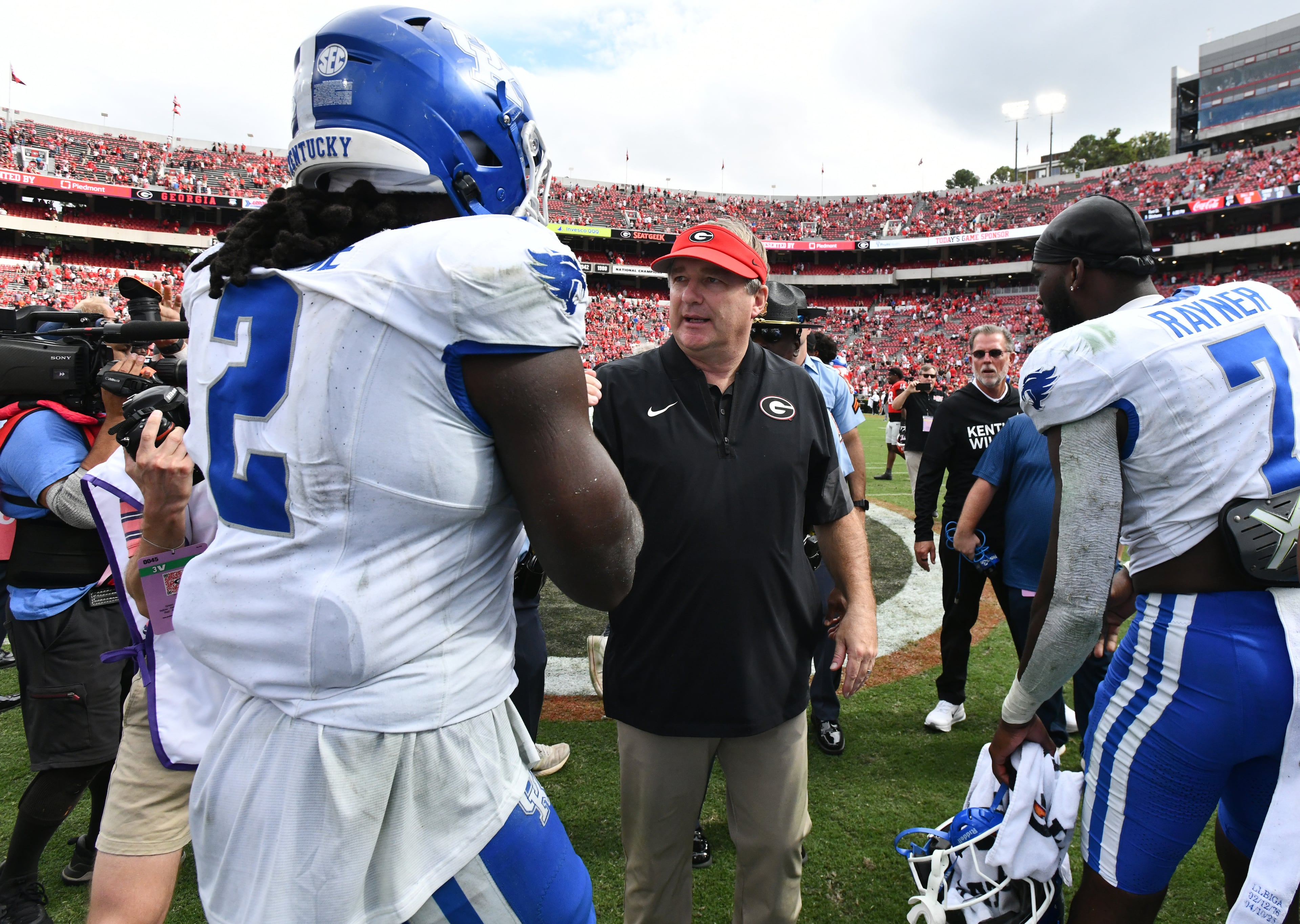 Georgia head coach Kirby Smart talks to Kentucky linebacker Sam Greene (2) after Georgia beat Kentucky during a NCAA college football game at Sanford Stadium, Saturday, October 4, 2025, in Athens. Georgia won 35 -14 over Kentucky. (Hyosub Shin / AJC)