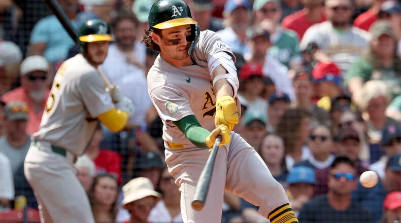 Athletics' Jacob Wilson takes a strike swinging during the fifth inning of a baseball game against the Boston Red Sox, Sunday, Aug. 9, 2026, in Boston. (AP Photo/Mark Stockwell)