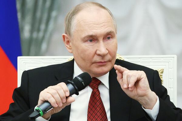 Russian President Vladimir Putin speaks with participants of the Time of Heroes, an educational program for veterans of special military operation, at the Kremlin in Moscow, Russia, Thursday, June 12, 2025. (Sergei Bulkin, Sputnik, Kremlin Pool Photo via AP)