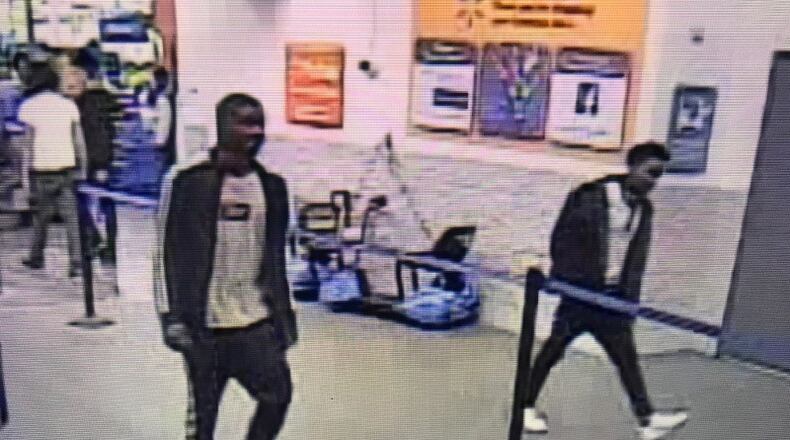 Investigators said the men hit a pedestrian while fleeing the Walmart parking.