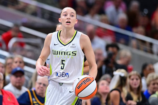 Dallas Wings' Paige Bueckers dribbles during the first half of a WNBA basketball game against the Indiana Fever, Sunday, July 13, 2025, in Indianapolis. (AP Photo/Doug McSchooler)