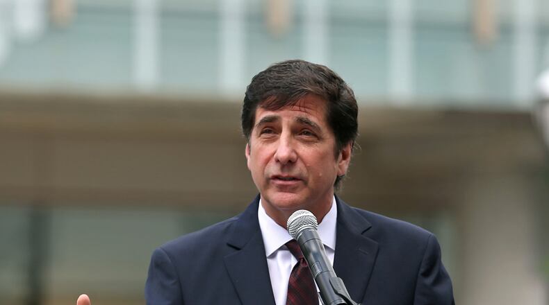 Dennis Adamovich, CEO of the College Football Hall of Fame,  speaks during a ceremony unveiling Chick-fil-A’s title sponsorship of the facility in May 2018.