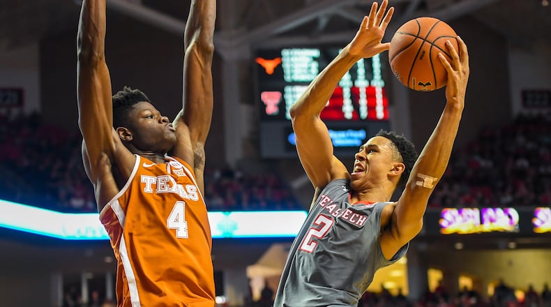 Zhaire Smith of the Texas Tech Red Raiders goes up for a shot against Mohamed Bamba of the Texas Longhorns during the game on January 31, 2018 at United Supermarket Arena in Lubbock, Texas. Texas Tech defeated Texas 73-71 in overtime. (Photo by John Weast/Getty Images)