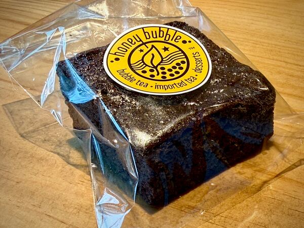 a brownie in plastic packaging with a honey bubble label