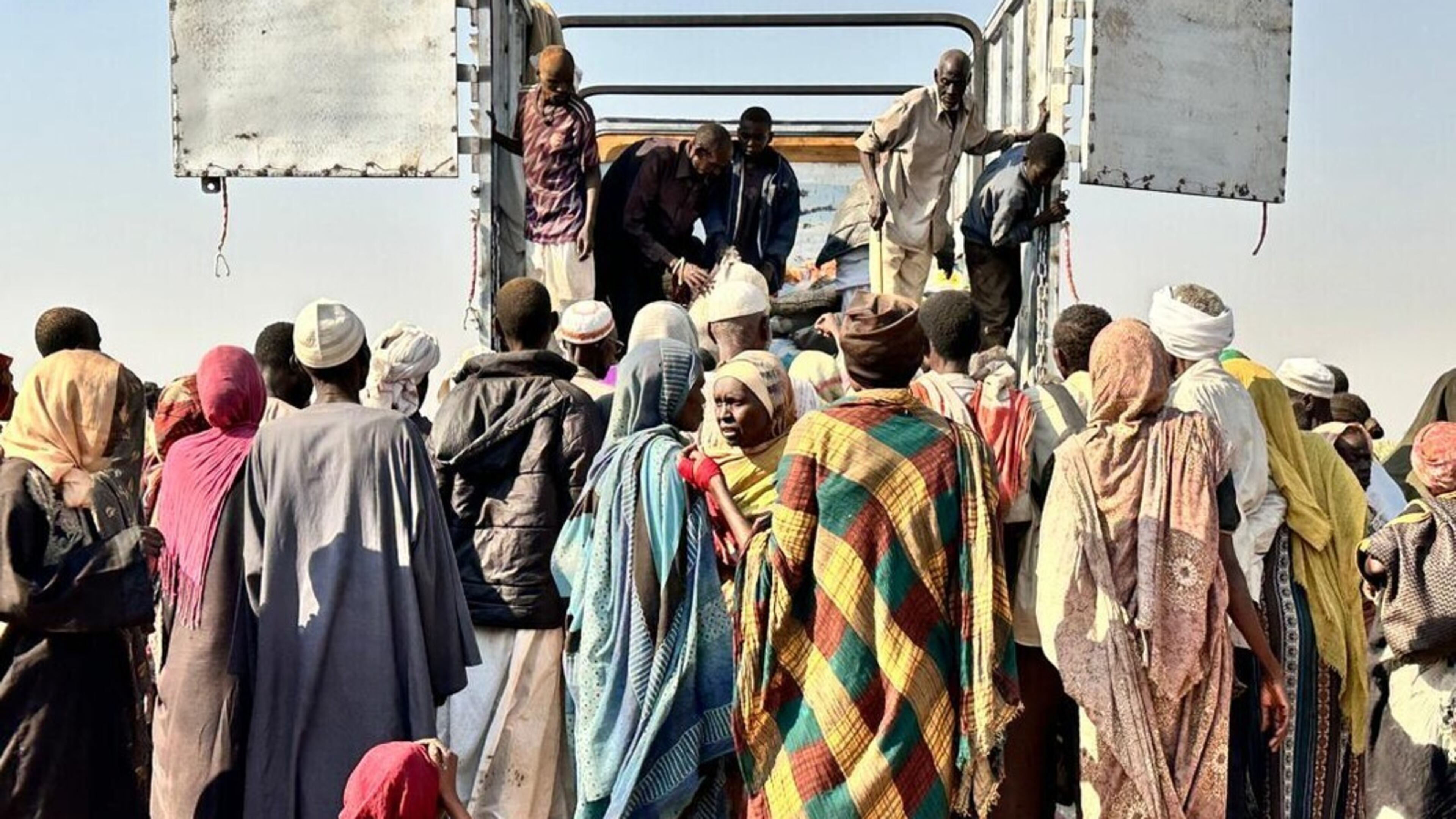 This photo released by The Norwegian Refugee Council (NRC) shows displaced families from el-Fasher at a displacement camp where they sought refuge from fighting between government forces and the RSF, in Tawila, Darfur region, Sudan, Friday, October. 31, 2025. (NRC via AP)