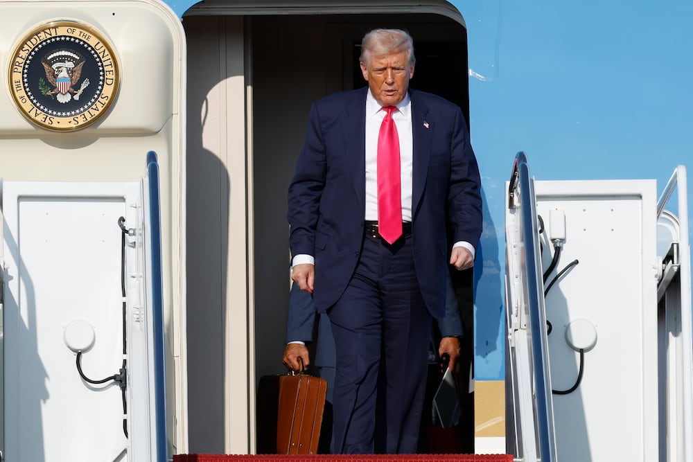 President Donald Trump walked off Air Force One upon his arrival at Joint Base Andrews in Maryland on Tuesday.