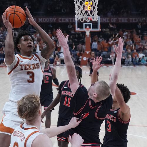 Texas guard Dailyn Swain (3) shoots the ball against Georgia during the second half of an NCAA college basketball game in Austin, Texas, Saturday, Jan. 24, 2026. (AP Photo/Eric Gay)