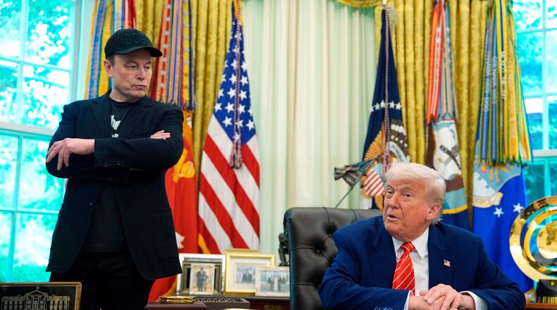 FILE - President Donald Trump, right, speaks during a news conference with Elon Musk in the Oval Office of the White House, May 30, 2025, in Washington. (AP Photo/Evan Vucci, File)