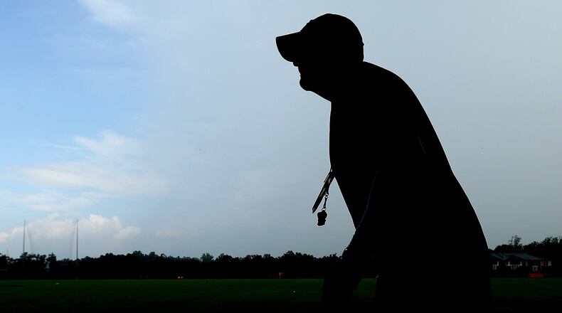 081915 FLOWERY BRANCH: Falcons head coach Dan Quinn heads to a media interview at the conclusion of team practice on Wednesday, August 19, 2015, in Flowery Branch. Curtis Compton / ccompton@ajc.com