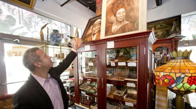 New Smyrna cigar specialty shops, allowed to serve alcoholic beverages, will need to pay half the fee at $3,100, instead of $6,200, since the alcohol revenue cap is set at 25 percent instead of 50 percent. AJC file photo