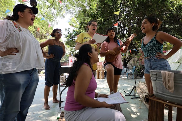 Director Paola Izquierdo, left, helps Mulato Teatro cast members harmonize their voices as they rehearse for their upcoming performance at the First International Afro-Scenic Festival, in Ticumán, Mexico, Saturday, May 17, 2025. (AP Photo/Ginnette Riquelme)