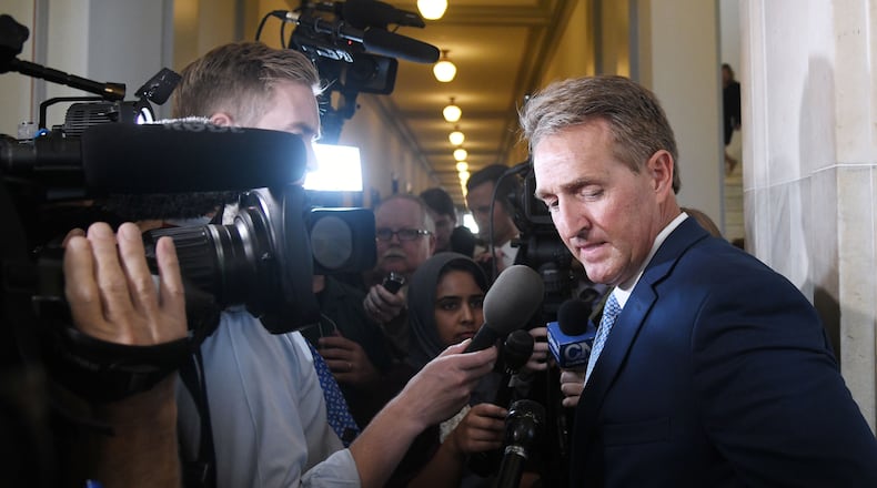 U.S. Sen. Jeff Flake, R-Ariz., who will not run for re-election, answers questions from reporters on Tuesday. Olivier Douliery/Abaca Press/TNS