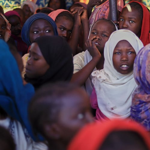 This photo released by The Norwegian Refugee Council (NRC), shows displaced women and children from el-Fasher at a camp where they sought refuge from fighting between government forces and the RSF, in Tawila, Darfur region, Sudan, Monday, Nov. 3, 2025. (NRC via AP)
