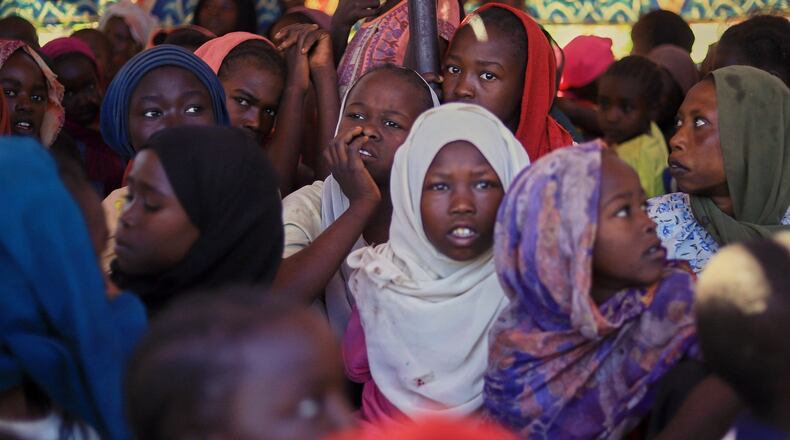 This photo released by The Norwegian Refugee Council (NRC), shows displaced women and children from el-Fasher at a camp where they sought refuge from fighting between government forces and the RSF, in Tawila, Darfur region, Sudan, Monday, Nov. 3, 2025. (NRC via AP)