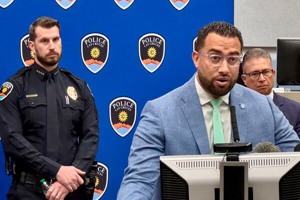 Las Cruces Police Department Chief Jeremy Story, from left, City Manager Ikani Taumoepeau and Mayor Eric Enriquez address a news conference about a fatal shooting at Young Park at Las Cruces City Hall in Las Cruses, N.M. Tuesday, March 25, 2025. (Algernon D'Ammassa/The Albuquerque Journal via AP)