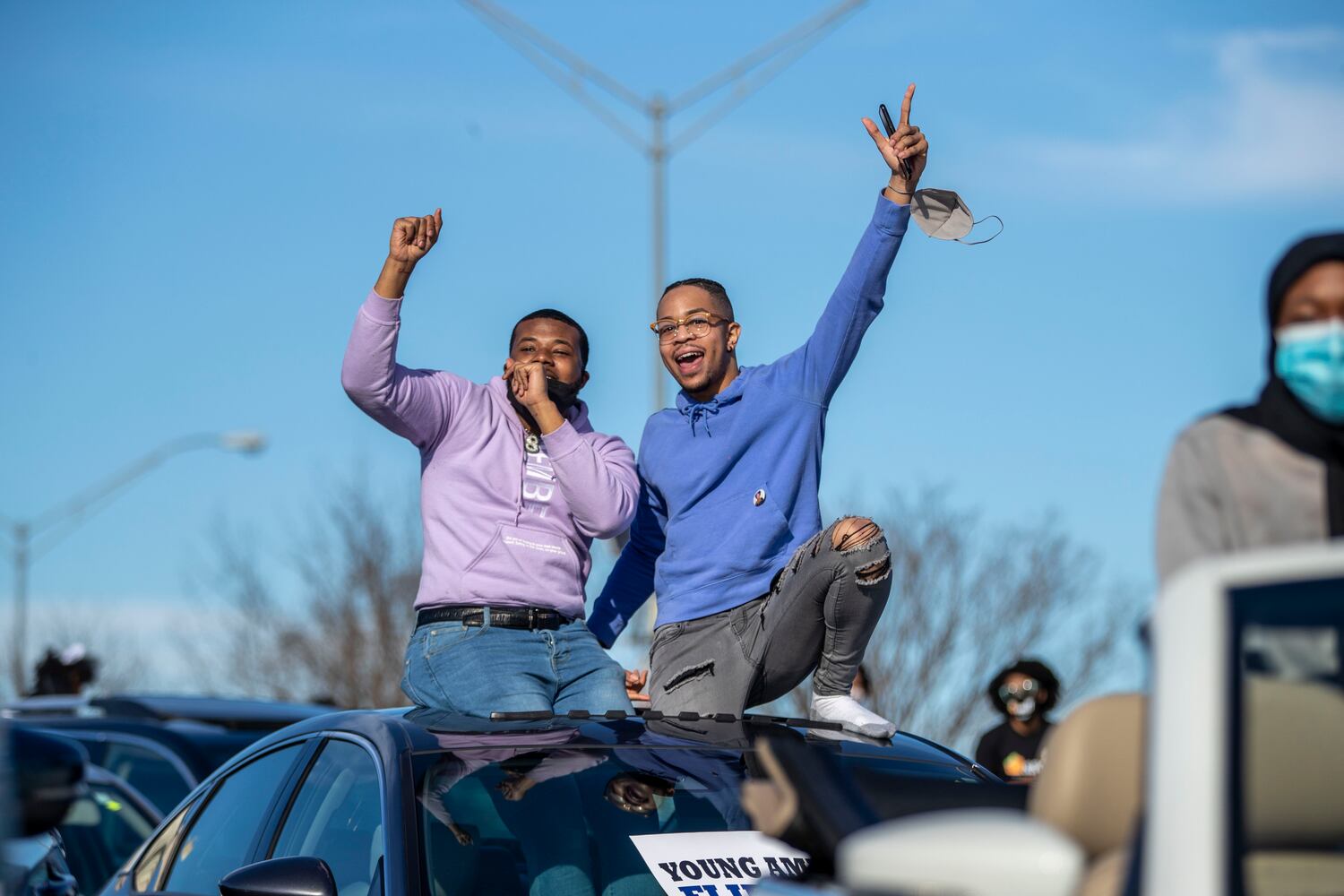 01/04/2021 — Atlanta, Georgia — Keon Berry (left) and Japan Durbin react as award winning singer Yolanda Adams performs during a Georgia Democrat U.S. Senate campaign rally in Atlanta’s Peoplestown neighborhood, Monday, January 4, 2021. (Alyssa Pointer / Alyssa.Pointer@ajc.com)