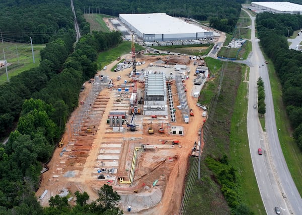 Aerial view of off-grid generators being installed, with the data center in the background, on Thursday, June 25, 2026, in Covington. (Hyosub Shin/AJC)
