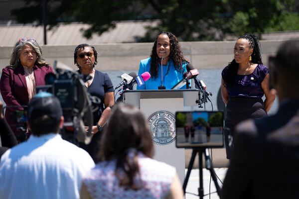 Metro Atlanta district attorneys (from left) Sonya Allen, Tasha Mosley, Sherry Boston and Fani Willis are challenging a new state law that would make their offices nonpartisan. (Ben Gray for the AJC)
