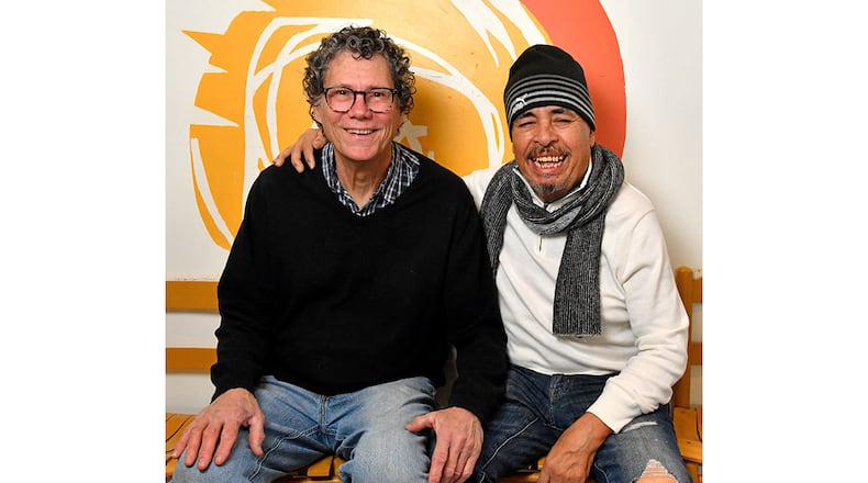Bill Wood, longtime bartender at Taqueria del Sol, poses for a portrait with Taqueria del Sol chef Eddie Hernandez.  Bill has been working here since 1991 and is retiring in February 2024.  (CHRIS HUNT FOR THE ATLANTA JOURNAL-CONSTITUTION)