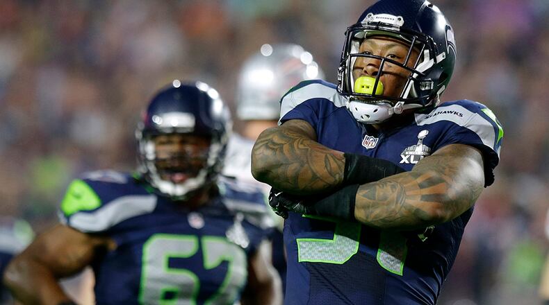 Seattle Seahawks outside linebacker Bruce Irvin (51) celebrates after sacking New England Patriots quarterback Tom Brady during the second half of NFL Super Bowl XLIX football game Sunday, Feb. 1, 2015, in Glendale, Ariz. (AP Photo/Michael Conroy) Once thought to be a risky first-round draft pick and a one-trick pony in the NFL that could only rush the passer, Seattle linebacker Bruce Irvin has developed into a defensive player that never leaves the field. (Michael Conroy / AP)