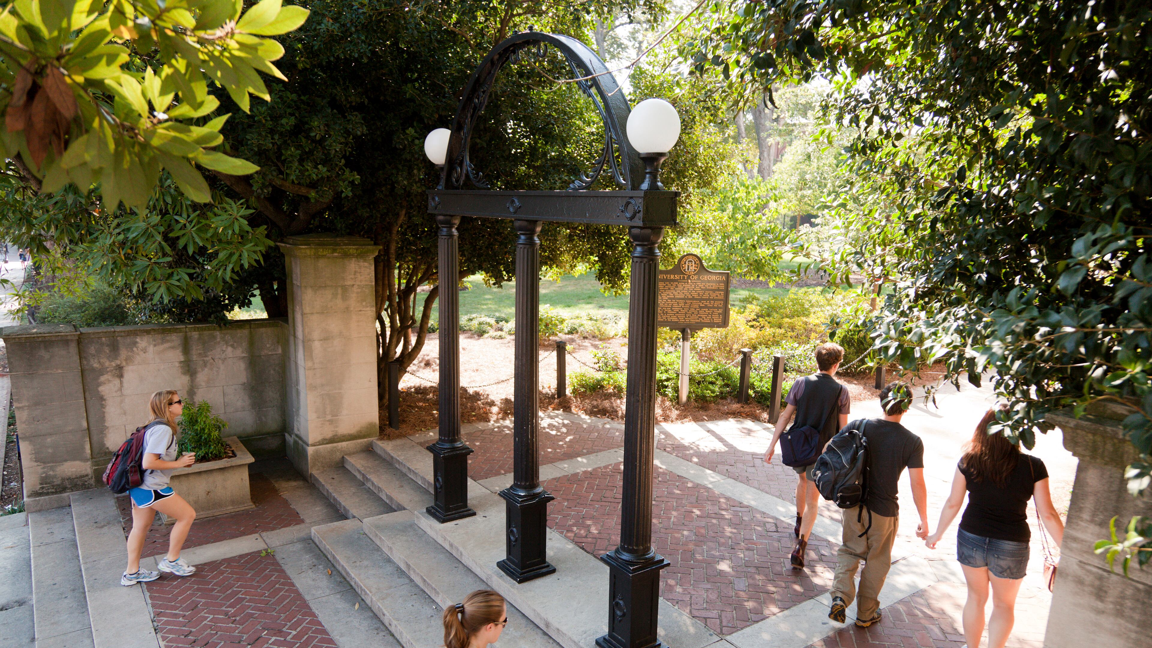 Students walk by the iconic arch on the University of Georgia campus. UGA recently changed its non-discrimination policy by removing language about "sexual orientation" and "gender identity." (Courtesy of Andrew Davis Tucker/UGA)