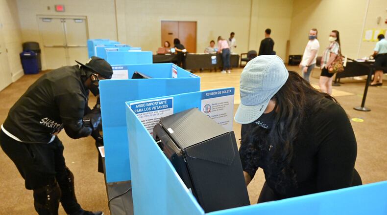 June 9, 2020 Norcross - Gwinnett County residents including Phaedra McKenzie (right) cast their votes during the Georgia primary elections at Pinckneyville Community Center in Norcross on Tuesday, June 9, 2020. âThere was no waiting line. It was smooth and easy.â McKenzie said. (Hyosub Shin / Hyosub.Shin@ajc.com)