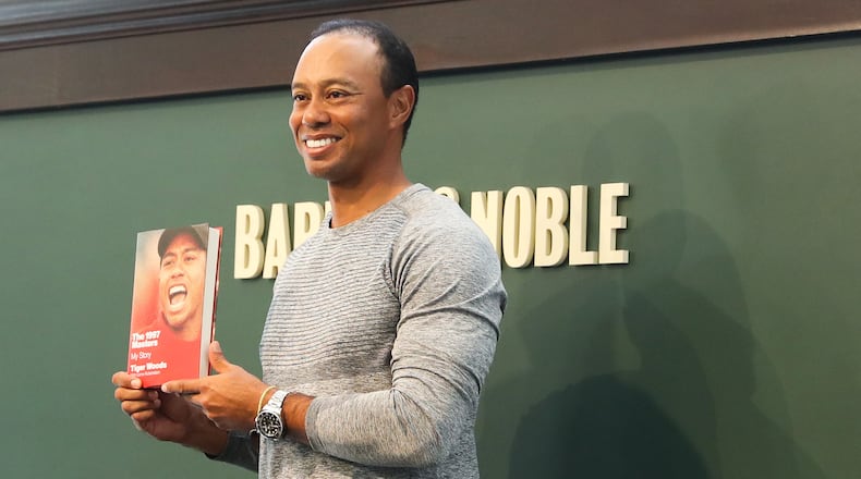 NEW YORK, NY - MARCH 20: Tiger Woods signs copies of his new book, "The 1997 Masters: My Story" at Barnes & Noble Union Square on March 20, 2017 in New York City. (Photo by Rob Kim/Getty Images)