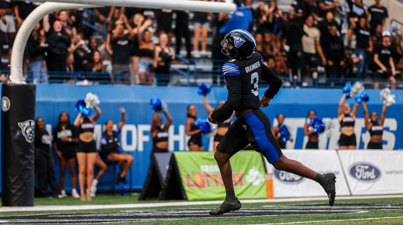 Darren Grainger completes a 65-yard touchdown run against UConn on Sept. 9, 2023. Grainger ran for 142 yards and threw for 144 yards in the win.