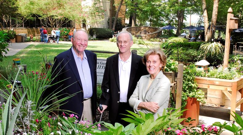 From left, Harold Shepherd, his son James, whose injury helped spark the founding of the Shepherd Center, and Alana Shepherd outside the center. (credit: Shepherd family photo)