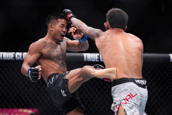 Joshua Van kicks Brandon Royval in a flyweight fight at UFC 317, Saturday, June 28, 2025, in Las Vegas. (AP Photo/John Locher)
