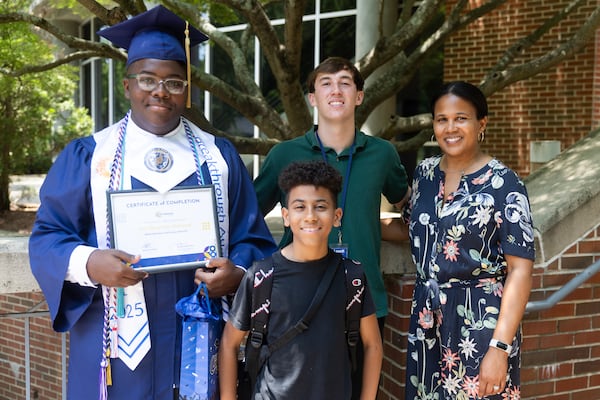 CEO of Breakthrough Atlanta Monique Shields (right) poses with teacher Sam Bartlett, (middle) graduate Sah’Quarion “Que” Howard (left) and student Jahsiah after the Scholar Send Off graduation ceremony at The Lovett School in Atlanta on Wednesday, June 25, 2025. (Abbey Cutrer / AJC)