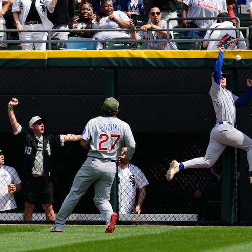 Chicago Cubs center fielder Pete Crow-Armstrong, right, cannot catch a two-run double hit by Chicago White Sox's Miguel Vargas during the fifth inning of a baseball game in Chicago, Sunday, May 17, 2026. (AP Photo/Nam Y. Huh)