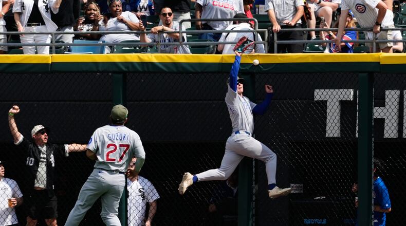 Chicago Cubs center fielder Pete Crow-Armstrong, right, cannot catch a two-run double hit by Chicago White Sox's Miguel Vargas during the fifth inning of a baseball game in Chicago, Sunday, May 17, 2026. (AP Photo/Nam Y. Huh)
