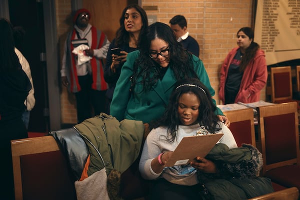Students register to vote for school board elections during a Town Hall at the Bethany Baptist Church, Saturday, Feb. 1, 2025, in Newark, N.J. (AP Photo/Andres Kudacki)