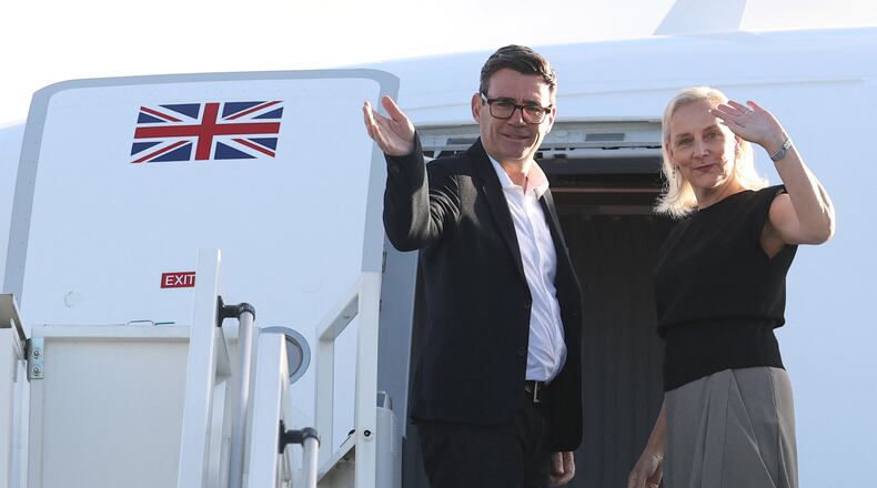 Britain's Prime Minister Andy Burnham and his wife Marie-France van Heel board a plane for the United States, at Stansted Airport, Stansted, England, Monday Sept. 21, 2026, to attend the UN General Assembly in New York. (Toby Melville/Pool Photo via AP)