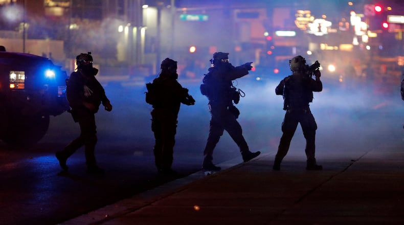 Three men with ties to the U.S. military and alleged to be members of an extreme white supremacist group face multiple terrorism conspiracy charges of planning to wreak havoc at protests in Las Vegas over George Floyd’s death.