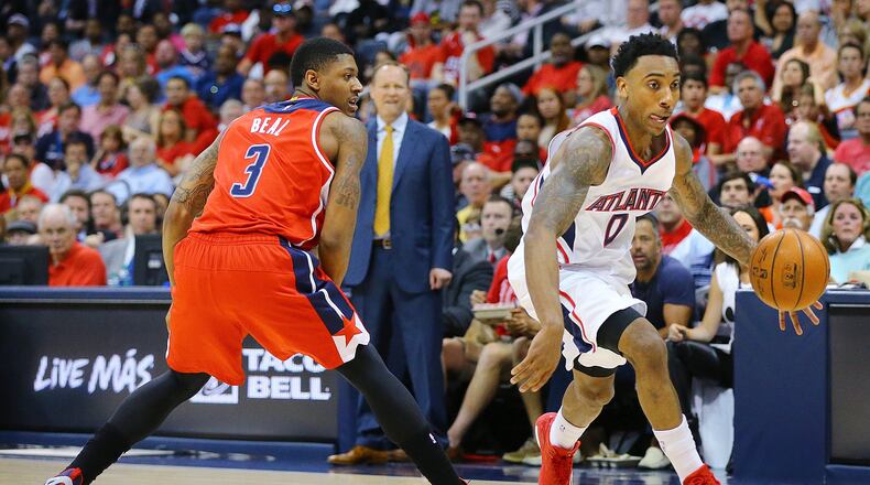 Hawks guard Jeff Teague drives around Wizards guard Bradley Beal in their Eastern Conference Semifinals Game 5 on Wednesday, May 13, 2015, in Atlanta. Curtis Compton / ccompton@ajc.com