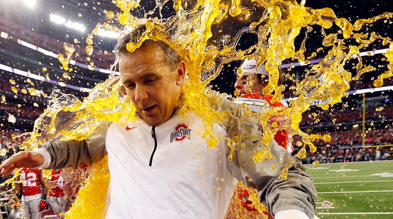 Ohio State celebrates their 42-20 win over Oregon for the first national championship of the College Football Playoff with Gatorade shower of coach Urban Meyer.