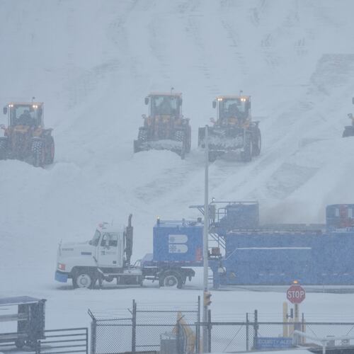 Airport crew plow snow during a winter storm in Philadelphia, Sunday, Jan. 25, 2026. (AP Photo/Matt Rourke)