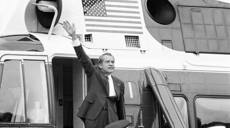 FILE -In this Aug. 9, 1974, file photo, President Richard Nixon waves goodbye from the steps of his helicopter outside the White House after delivering a farewell address to members of the White House staff. (AP Photo/Chick Harrity, File)