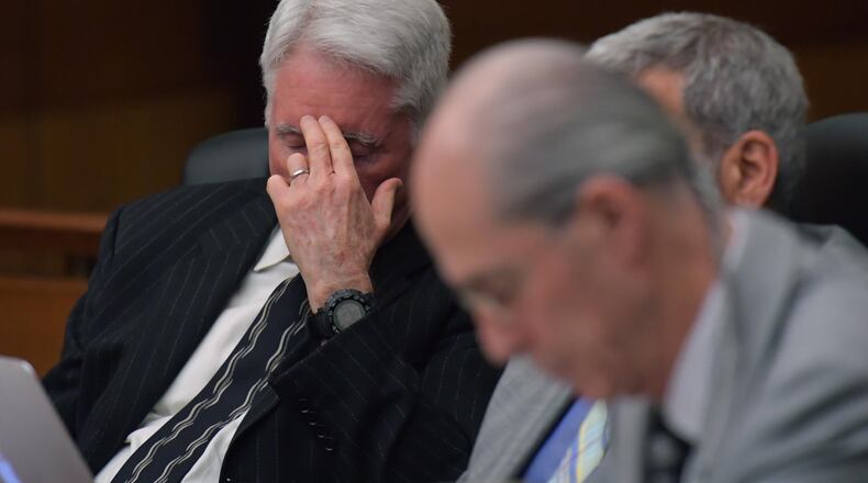 March 22, 2018 Atlanta - Tex McIver (left) reacts as he sits with his defense attorneys during Day 8 of the Tex McIver murder trial at Fulton County Courthouse on Thursday, March 22, 2018. HYOSUB SHIN / HSHIN@AJC.COM