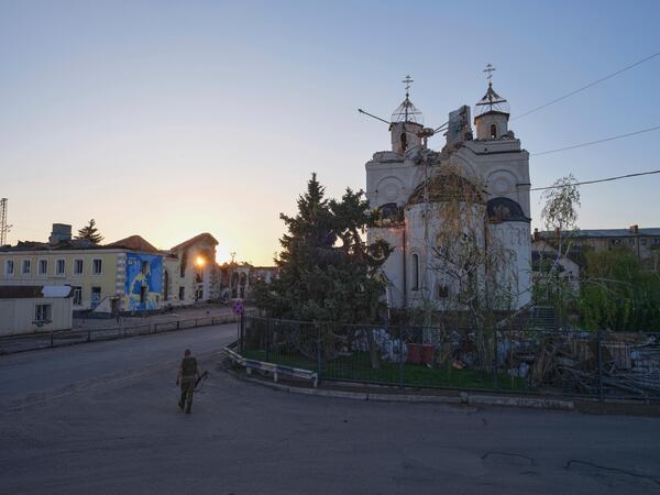 In this photo provided by Ukraine's 93rd Kholodnyi Yar Separate Mechanized Brigade press service, a soldier passes by a damaged church in Kostyantynivka, the site of heavy battles with Russian troops, in the Donetsk region, Ukraine, Saturday, April 19, 2025. (Iryna Rybakova/Ukraine's 93rd Mechanized Brigade via AP)