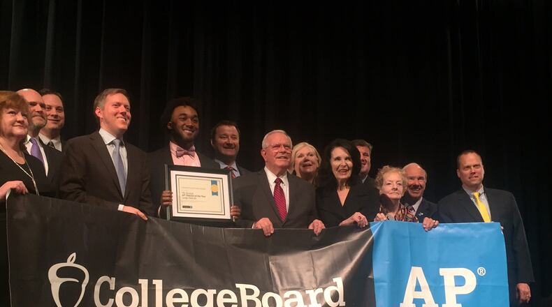 Gwinnett County school district and College Board officials pose for photos after a ceremony at Duluth High School on Feb. 21, 2017 in which the board named Gwinnett its Advanced Placement District of the Year among the nation's largest school districts. ERIC STIRGUS/ESTIRGUS@AJC.COM