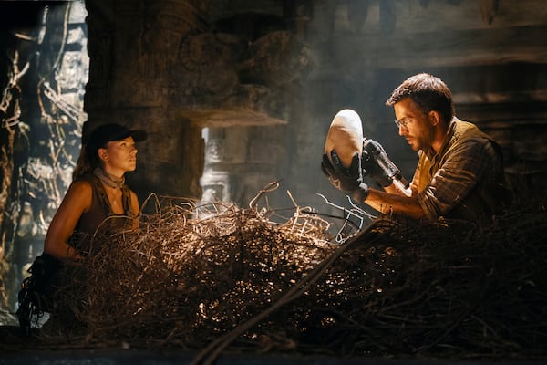This image released by Universal Pictures and Amblin Entertainment shows Scarlett Johansson, left, and Jonathan Bailey in a scene from " Jurassic World Rebirth." (Jasin Boland/Universal Pictures and Amblin Entertainment via AP)