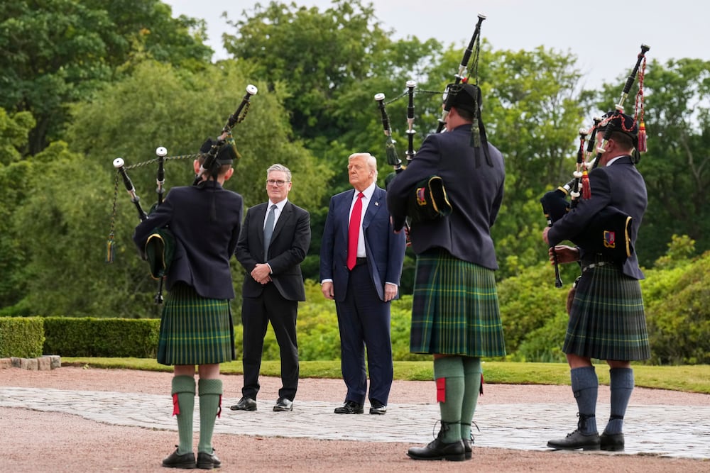 President Donald Trump (third right) and British Prime Minister Keir Starmer were welcomed at Trump International Golf Links in Scotland on Monday.