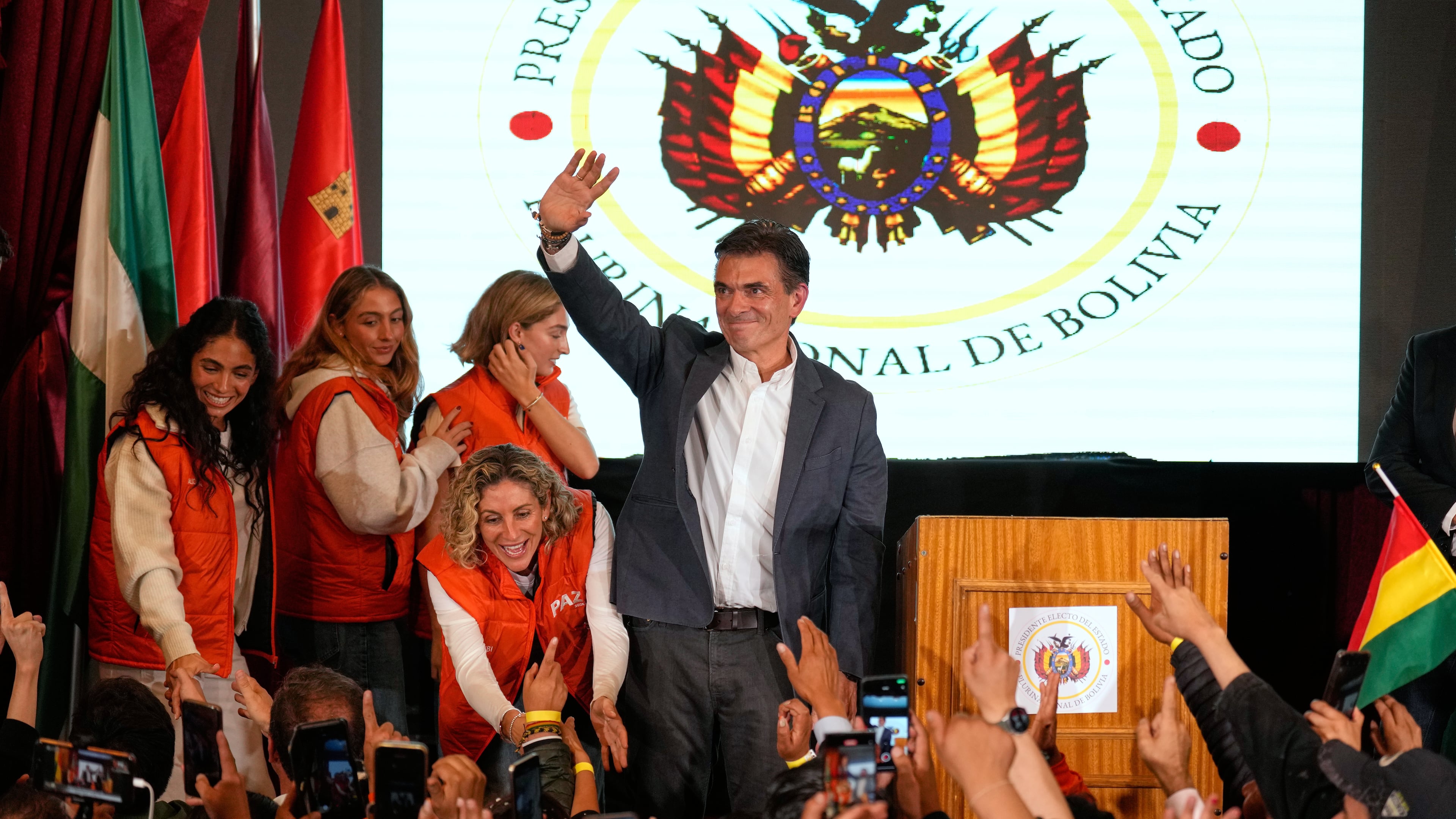 Presidential candidate Rodrigo Paz waves to supporters after preliminary results showed him leading in the presidential runoff election in La Paz, Bolivia, Sunday, Oct. 19, 2025. (AP Photo//Natacha Pisarenko)