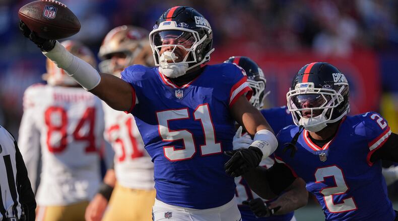 New York Giants linebacker Abdul Carter (51) reacts after recovering a fumble by the San Francisco 49ers during the second quarter of an NFL football game, Sunday, Nov. 2, 2025, in East Rutherford, N.J. (AP Photo/Seth Wenig)