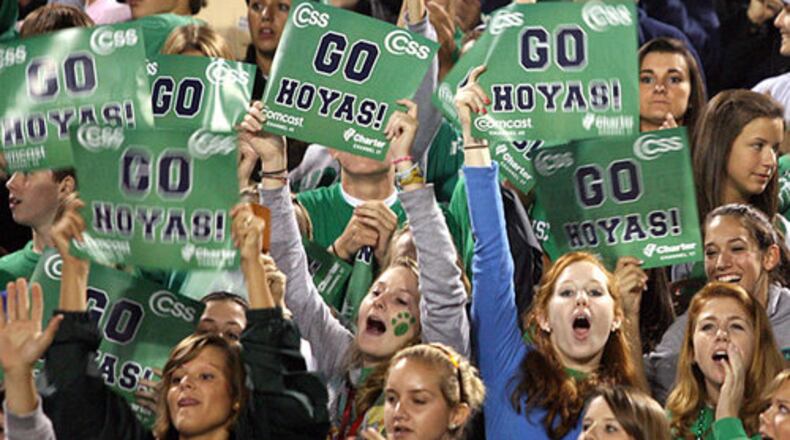 Let's go, Hoyas! The home crowd is fired up for Friday night's region clash between host Harrison and the East Paulding Raiders.