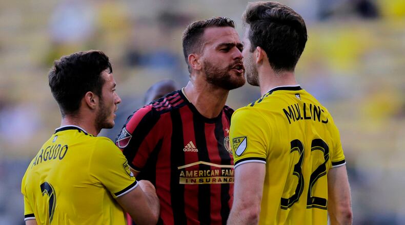 Atlanta United defender Leandro Gonzalez Pirez and Columbus Crew SC forward Patrick Mullins (32) exchange words during the first half in the Round of 16 of the U.S. Open Cup Tuesday, June 18, 2019, at MAPFRE Stadium in Columbus, Ohio.