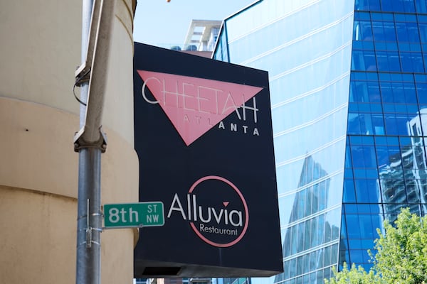 The Cheetah Lounge sign in Midtown is visible from 8th Street on Monday, May 18, 2026. Although the site is set for redevelopment into student housing, it will remain open at least through the World Cup, and possibly longer. (Miguel Martinez/AJC)